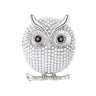 Owl brooch with silver-tone finish, glossy white round beads, black eyes, and curved branch detail, cutout on white background.