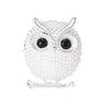 Owl brooch with silver-tone finish, white round beads, black gem-like eyes, and perch design, cutout on white background.