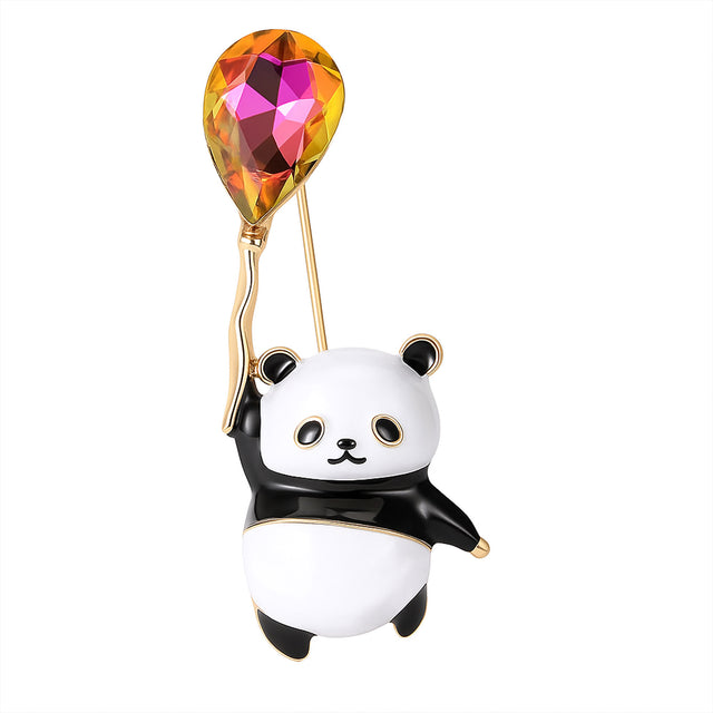 Panda brooch in black and white enamel holding a teardrop-shaped faceted balloon stone in orange, pink, and yellow tones, cutout on white.
