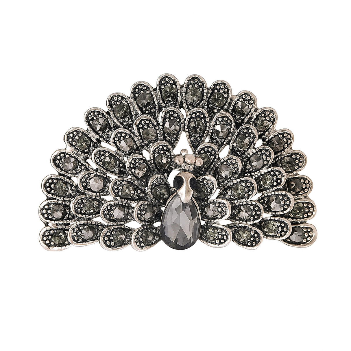 Peacock brooch with black faceted stones and silver-tone base, teardrop center stone, cutout on white.