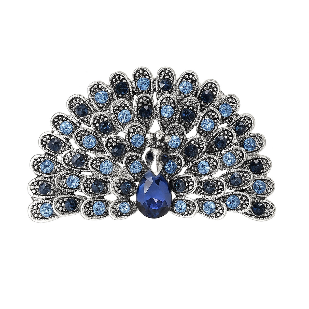 Peacock brooch with light and dark blue faceted stones, silver-tone metal, and blue teardrop center stone, cutout on white.