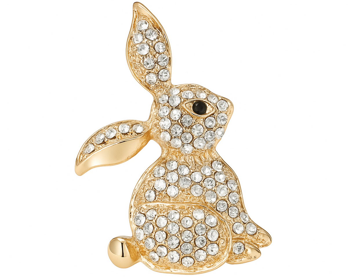 Bunny brooch with gold-tone finish, clear faceted stones, and black eye detail, cutout on white background. Landscape crop for secondary use.