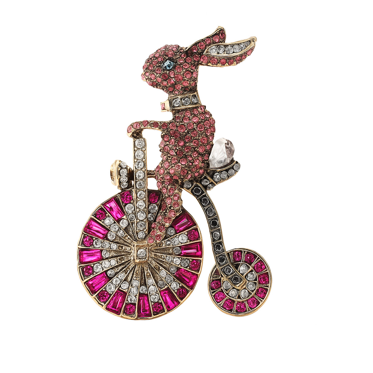 Bunny brooch with pink rhinestone pave, riding a bicycle with clear and magenta stone wheels. Cutout on white background.