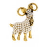 Ram brooch with gold-tone metal finish, clear faceted stones on face, and white round beads on body. Cutout on white background.