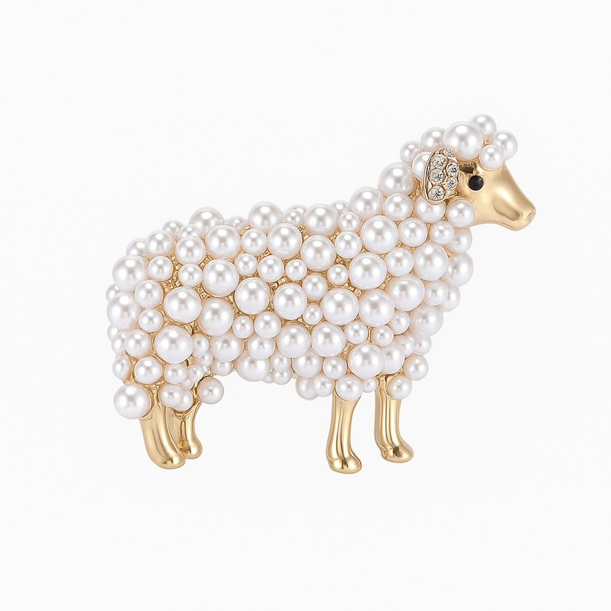 Sheep brooch with gold-tone metal, white round beads, and small clear stones on ear, cutout on white background.