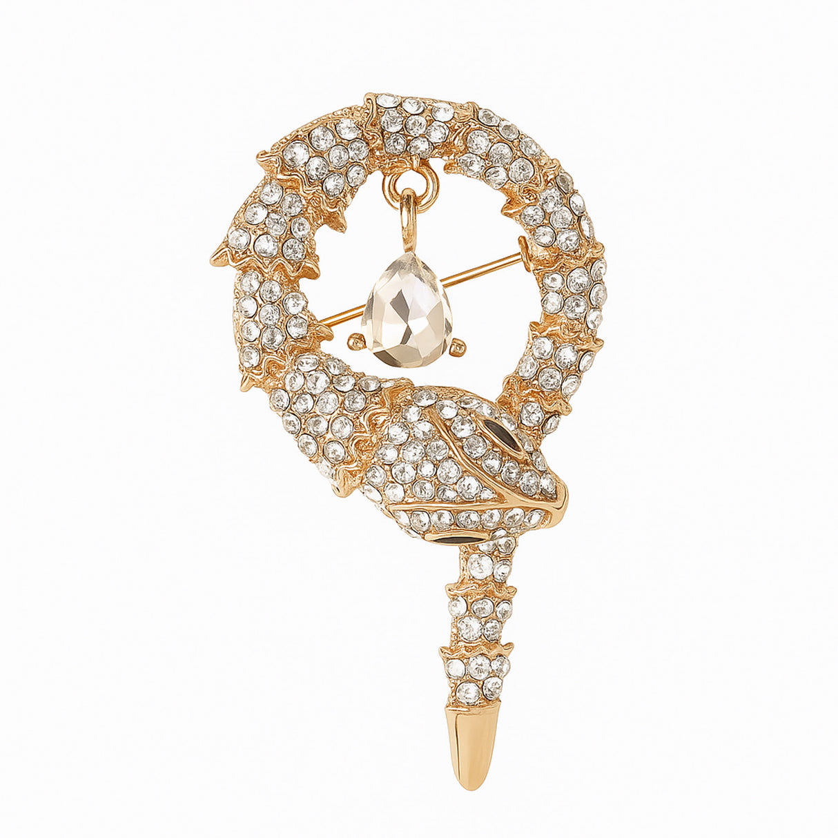 Snake brooch with gold-tone finish, clear faceted stones, and hanging teardrop-shaped clear pendant, cutout on white.