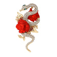 Snake brooch in gold-tone metal with clear pave-set stones, green eyes, and red rose detailing. Cutout on white background.