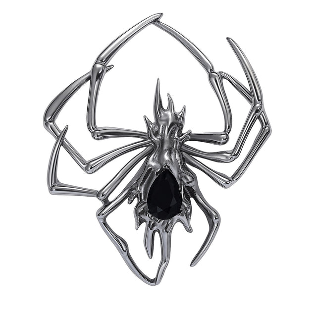 Spider brooch with dark silver-tone metal and black teardrop-shaped faceted center stone, cutout on white background.