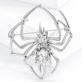 Silver-tone spider brooch with clear decorative center stone, upright studio shot.