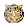 Tiger head brooch with gold-tone finish, half covered in clear faceted stones and black enamel stripes, green-tone eyes, cutout on white.