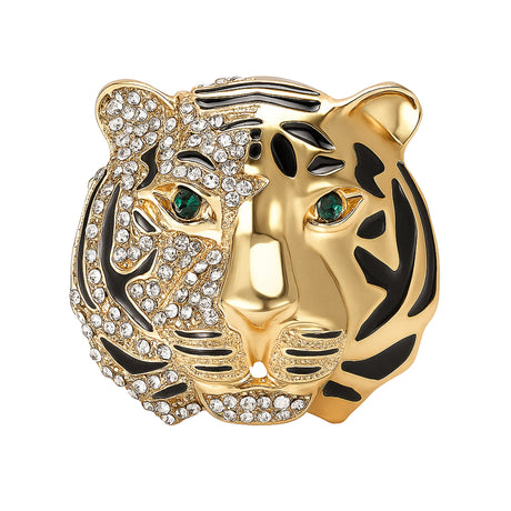 Tiger head brooch with gold-tone finish, half covered in clear faceted stones and black enamel stripes, green-tone eyes, cutout on white.