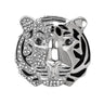 Tiger head brooch with silver-tone finish, half embellished with clear stones and black enamel stripes, cutout on white.