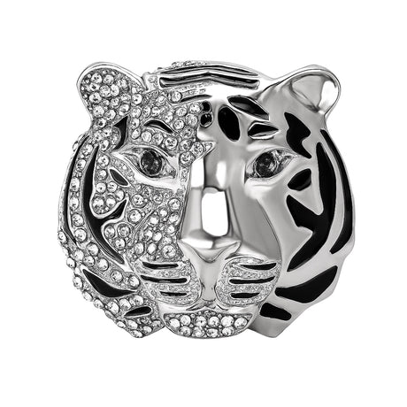 Tiger head brooch with silver-tone finish, half embellished with clear stones and black enamel stripes, cutout on white.
