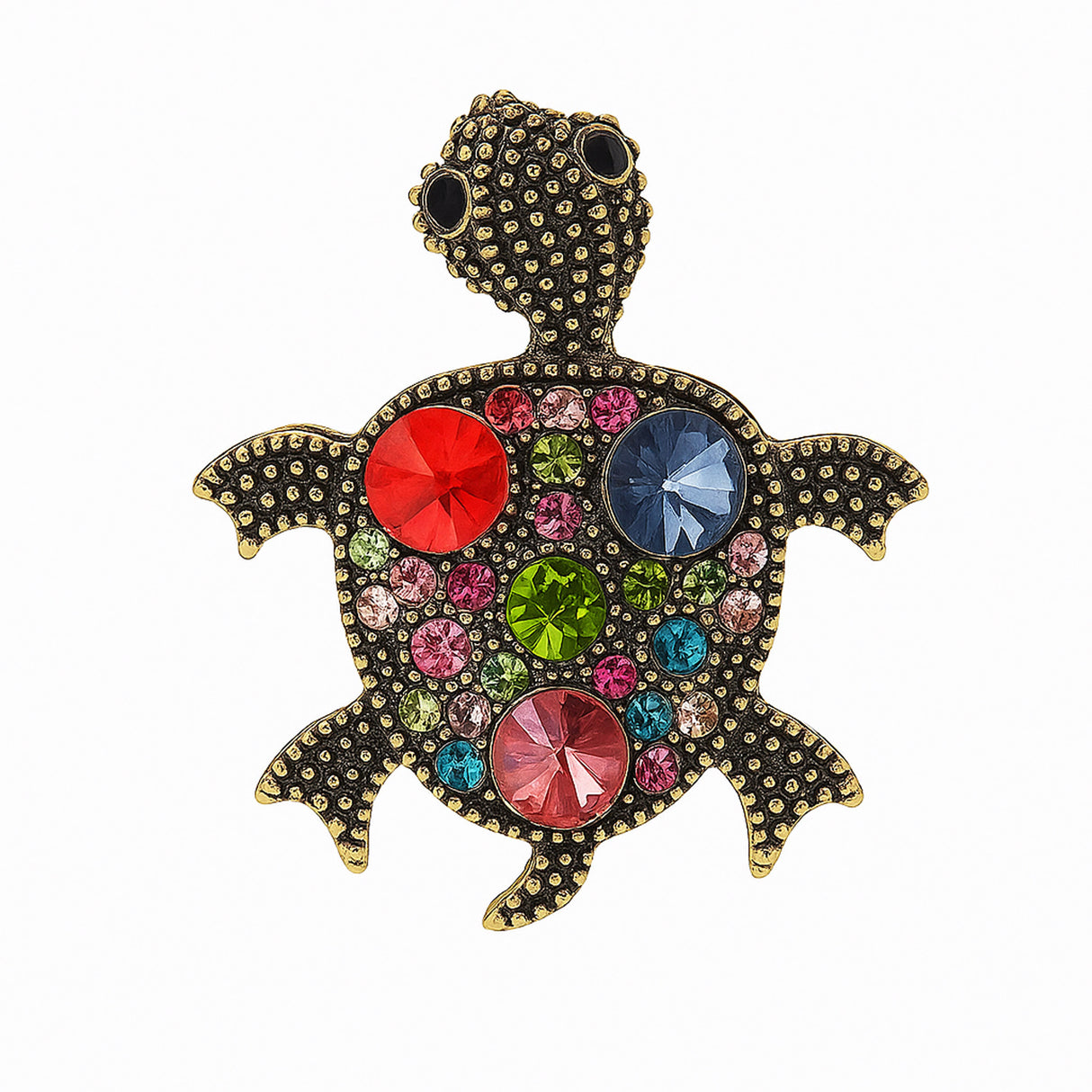 Turtle brooch with antique-inspired gold-tone dotted metal surface and multicolor round faceted stones in pink, red, blue, and green. Cutout on white.